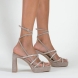 Sandalias de la marca Mim, modelo NORI. Exterior de las sandalias en ante color taupe compuesto con varias tiras con glitter a tono y dos tiras largas para atar en el tobillo. Interior de las sandalias en ante color taupe. Cierre de las sandalias Mim con hebilla y un tacón de 10cm de altura. Estas sandalias Mim NORI son ideales para tus eventos más importantes de temporada, te ayudarán a estilizar y crear diferentes looks con elegancia y estilo.