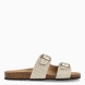 Sandalia para mujer de la marca Geox modelo BRUNNA. Elaborada en piel color oro con detalle de doble tiras en pala, de estilo diario, que garantiza confort y transpirabilidad durante todo el día. Cierre con doble hebilla en pala. Este modelo, cuenta con una empella de suave gamuza. Ideal para la ciudad, BRUNNA está pensada para añadir un toque moderno a los looks de verano.