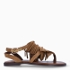 Sandalias esclavas de la marca INUOVO, modelo IVANNA. Elaboradas en piel color camel con flecos en pala y adornos de piedreía doradas incrustadas. Interior en piel color marrón. Cierre con hebilla en tobillo. Sandalias INUOVO IVANNA, complemento ideal para lucir tus looks con estilo y comodidad!