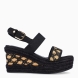 Sandalias de la marca Lola Casademunt, modelo NAIA. Sandalias elaboradas en lona color negro con detalle en tejido color camel. Interior en textil color negro. Cierre de las sandalias Lola Casademunt con hebilla en el tobillo y una cuña de 10cm de altura. Estas sandalias Lola Casademunt NAIA son ideales para tus looks de temporada!
