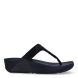 Sandalias de la marca Fitflop, modelo Lulu Crystal. Exterior en ante color negro, decorado con brillantes. Interior en microfibra de color taupe. Suela de caucho antideslizante y planta acolchada. Cuña de 4 cm incluyendo 2,5 cm de plataforma. Con detalle de piel sintética perlada metalizada en los laterales. Fabulosas de día y de noche.