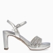 Sandalias de la marca Tamaris, modelo MAGDA. Sandalias elaboradas en ecopiel color plata con tiras en la pala con piedrería brillante. Interior en piel color plata. Cierre de sandalias Tamaris con hebilla en tobillo y tacón de 9cm de altura. Sandalias Tamaris MAGDA complemento ideal para lucir tus looks en eventos!