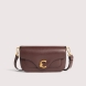Bolso de la marca Coccinelle, modelo C-ME. Bolso elaborado en piel color burdeos con adorno dorado de logotipo marca. Las líneas geométricas y las elegantes curvas realzan el diseño. Cierre con imán y asa de hombro. Modelo C-ME con un tamaño perfecto para funcionalidad y elegancia. Bolso Coccinelle, modelo que te aportará a tus looks un estilo discreto y refinado. Medidas: alto 15cm y ancho 26cm.