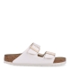 Sandalias de la marca Birkenstock, modelo ARIZONA BIRKO. Sandalias elaboradas en piel de alta calidad color blanco, con base de corcho y látex de forma anatómica. Cierre de las sandalias con doble hebilla de espiga de metal con ajuste individual, en empeine y pala. Estas sandalias Birkenstock ARIZONA BIRKO son un complemento ideal para esta temporada, su diseño simple atemporal, lo hace el accesorio clásico para tus looks!