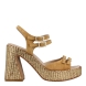 Sandalias de la marca Munné, modelo Yola. Exterior de las sandalias en ante color cuero con detalle trenzado color dorado. Interior de las sandlias en piel color beig. Cierre de las sandalias Munné, con cuatro hebillas, dos en la pala, y dos en el talón. Sandalias Munné con tacón de 9cm de altura. Estas sandalias Munné Yola tiene un diseño ideal para esta temporada, además de la comodidad en cada paso que des!