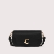 Bolso bandolera de la marca Coccinelle, modelo C-ME. Exterior en piel color negro con detalle de logo en parte frontal. Interior con compartimentos. Cierre con botón inmantado y doble asa, de mano y hombro. Medidas: alto 15cm y ancho 26cm. Este bolso Coccinelle C-ME es un complemento sofisticado, ideal para combinar con tus looks de temporada!