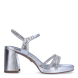 Sandalias de la marca Tamaris, modelo GIA. Exterior en piel color plata con tiras en pala y talón con aplicaciones de pedrería brillante. Interior en piel color plata. Cierre de sandalias Tamaris con hebilla en tobillo. Sandalias con tacón de 7cm de altura. Estas sandalias Tamaris GIA son ideales para las ocasiones especiales, te ayudarán a crear y estilizar diferentes looks!